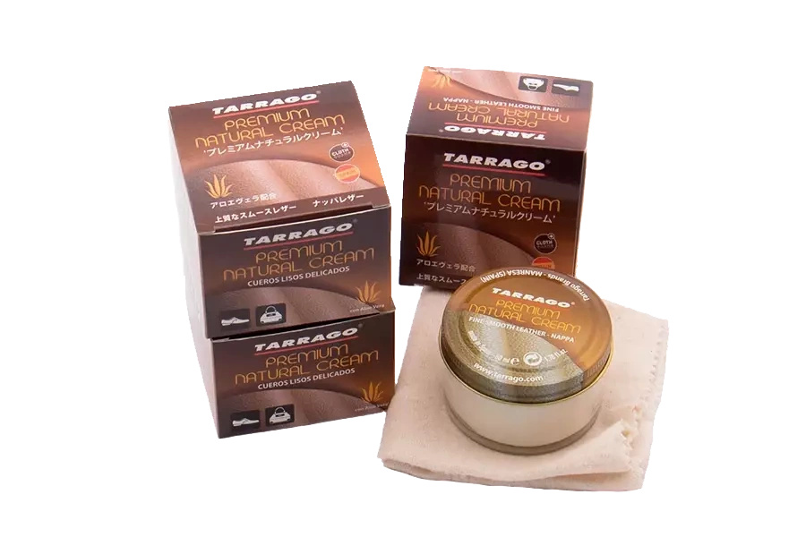 Krem odżywczy do skór Tarrago bezbarwny - dwa pudełka Premium Natural Cream i otwarty słoik na ściereczce
