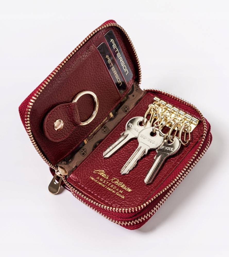 Otwarte czerwone etui Peterson BC-6000 z kluczami na haczykach