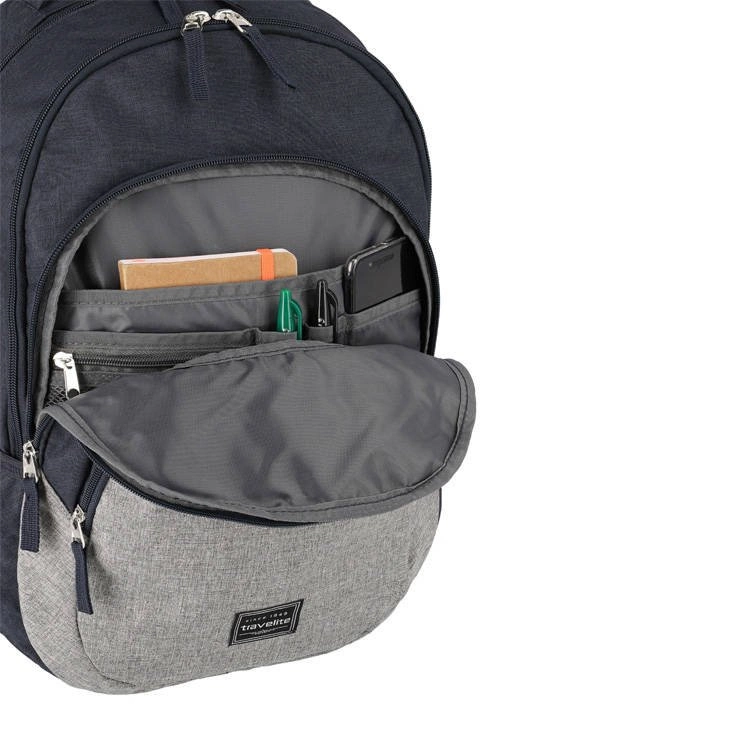 Granatowy plecak na laptopa Travelite Basics Melange z otwartą kieszenią z przodu, w organizerze notes, długopisy i telefon